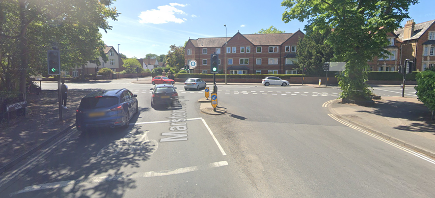 Cars using a traffic-lit junction at the intersection of Marston Ferry Road/Banbury Road junction