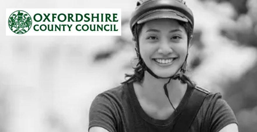Oxfordshire County Council logo and a female cyclist