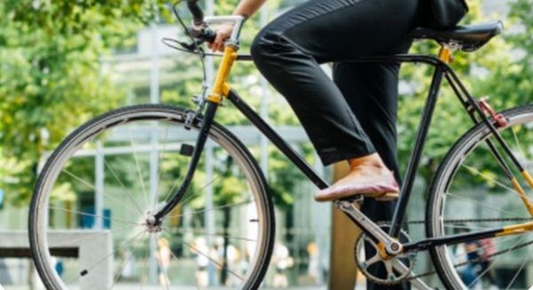 Image of a woman riding a bike