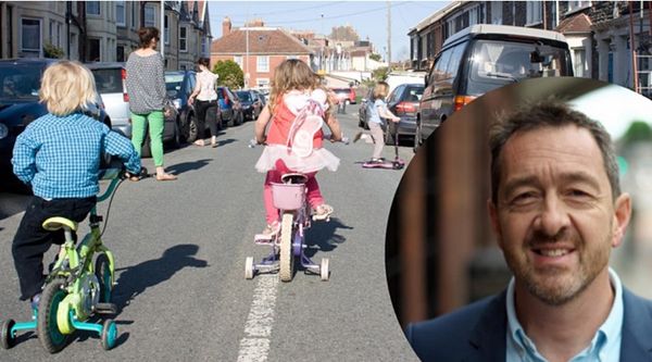 Children cycling and scooting between parked cars on a residential street; inset: Chris Boardman